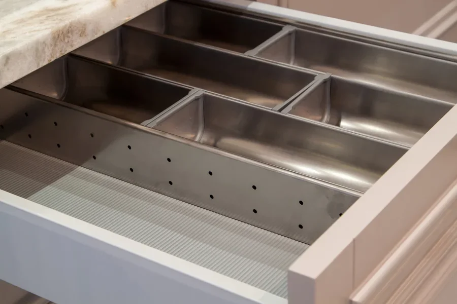 Metal cutlery organizer inside drawer with no utensils