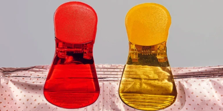 Red and yellow chip clips holding bag together