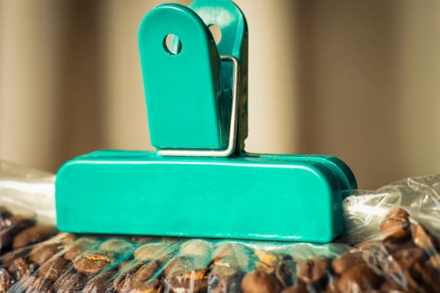 Teal clip used on plastic bag with magnet on back