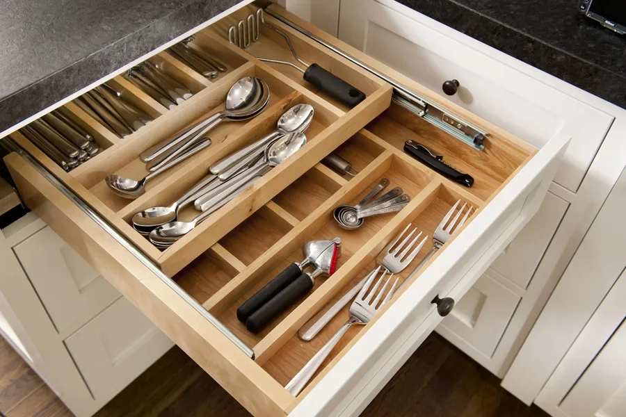 Wide kitchen drawer with stacked wooden cutlery organizers