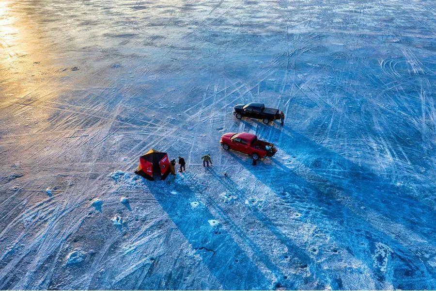 Aerial view of people fishing over ice