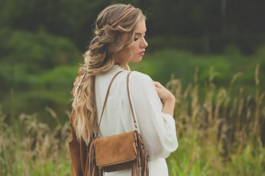 Beautiful Woman with Suede Handbag Outdoor
