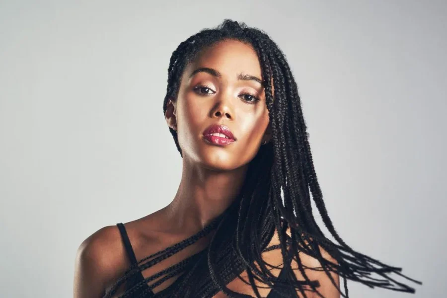 Beautiful Young Woman with Plaits and Twists Hairstyle