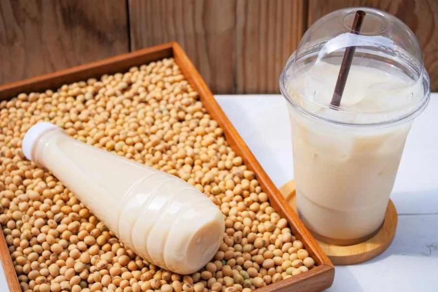 Bottle of Soy Milk And Soybean on Wooden Table