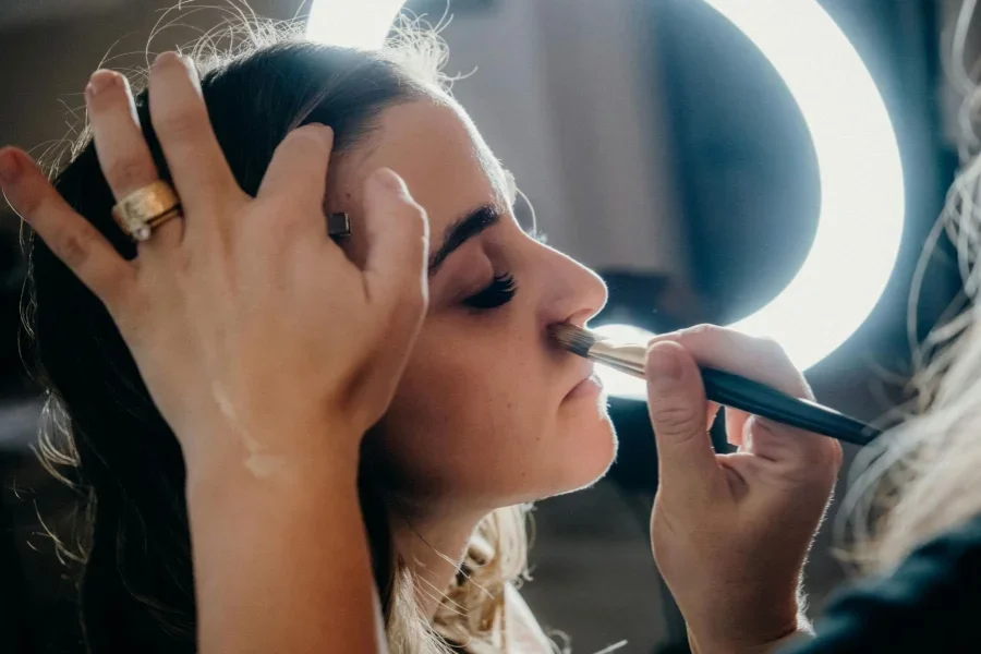 Close-Up Shot of a Woman Doing Make-Up