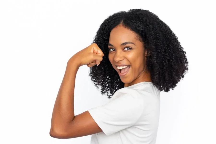 Happy African American Woman Showing Bicep