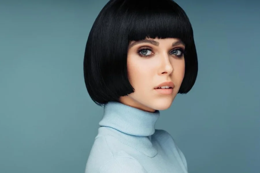 Model with Pageboy Haircuts Against Blue Background