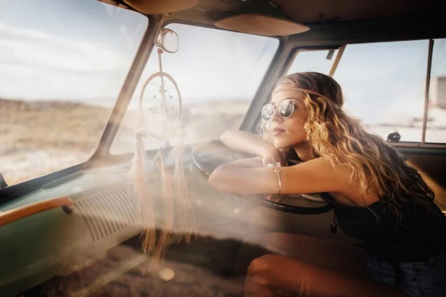 Road Trip Hipster Girl Sitting in Retro Van