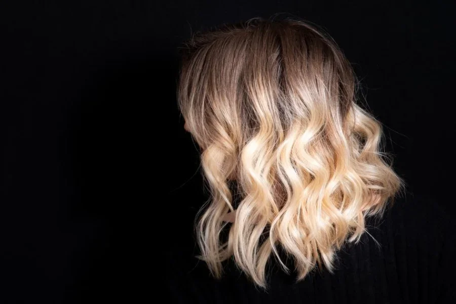 Rooty Blonde Mid Length Hairstyle
