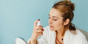Woman Spraying a Product on her Face