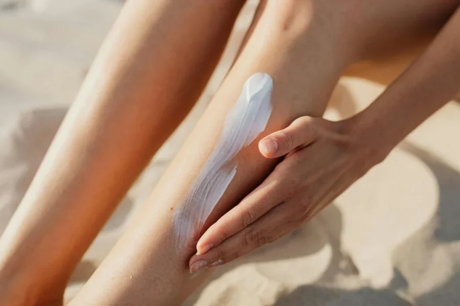 A Person Applying Cream on a Leg
