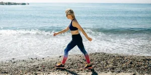 Active Woman Walking on the Beach