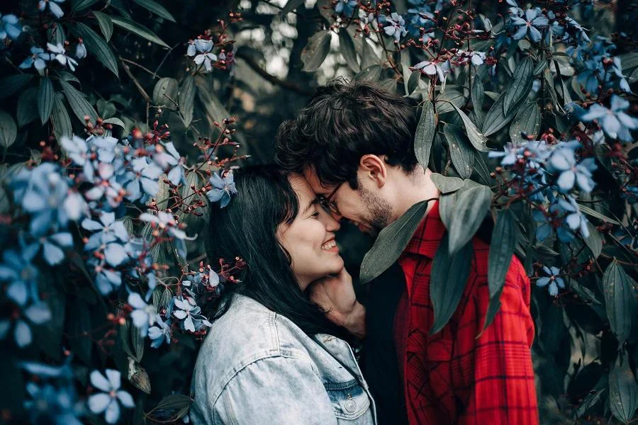 Man and Woman Standing under Flowering Tree